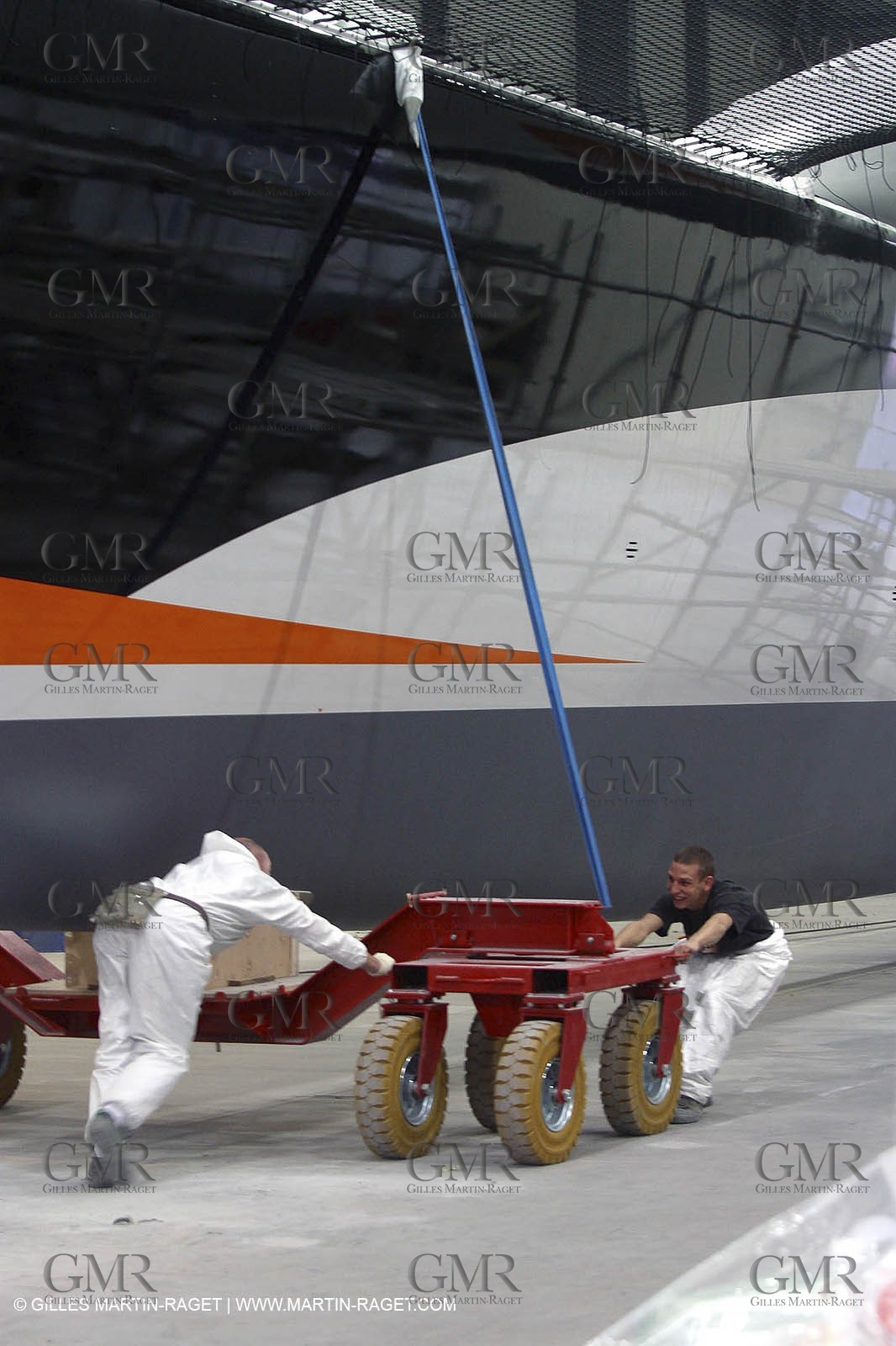 Vannes - Multiplast Boatyard - Orange II going out of the shed