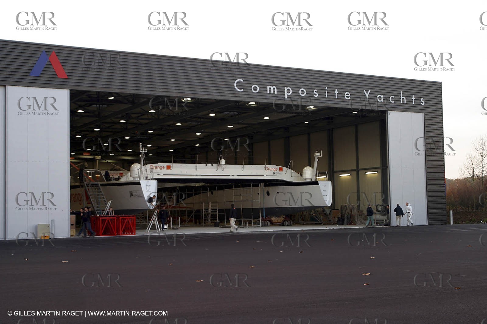 Vannes - Multiplast Boatyard - Orange II going out of the shed