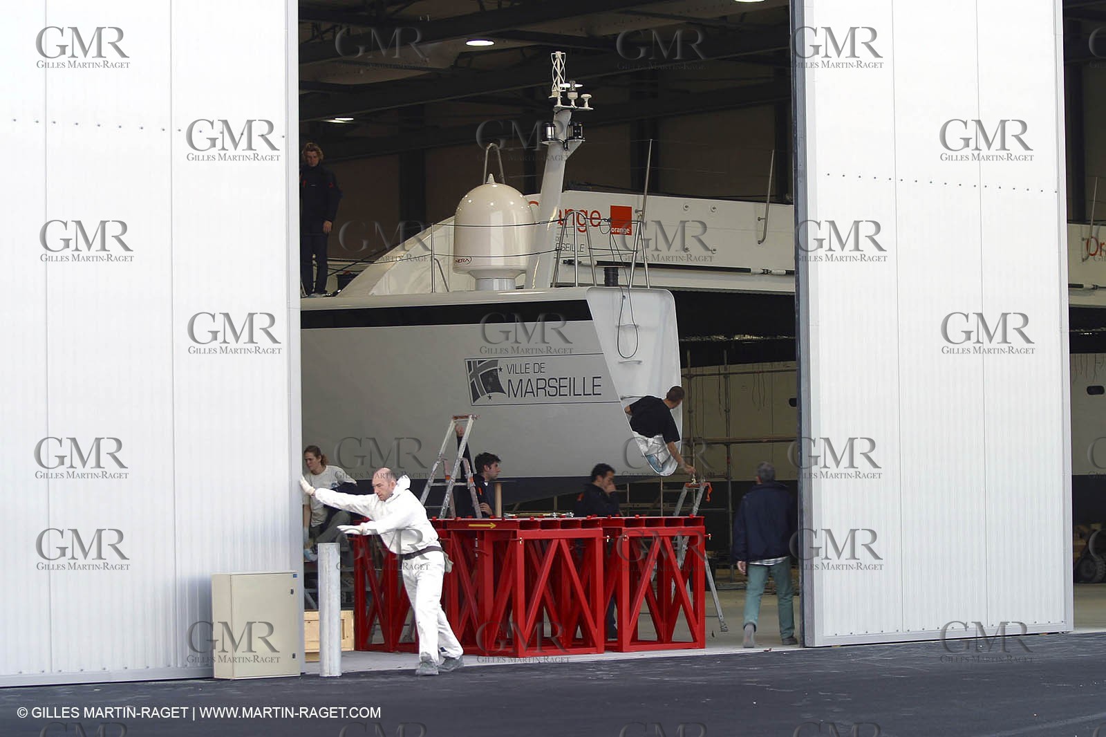 Vannes - Multiplast Boatyard - Orange II going out of the shed