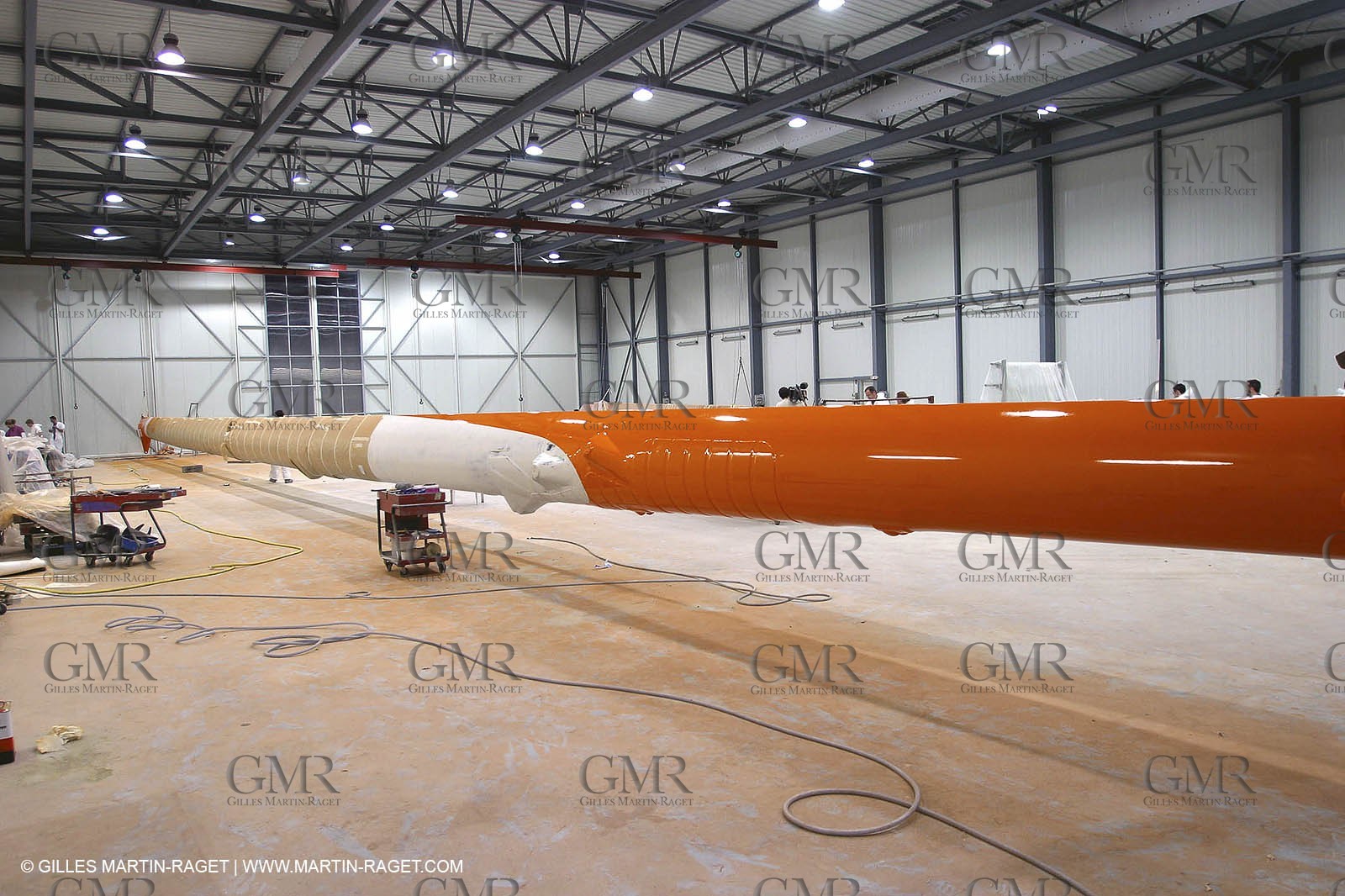 Vannes - Multiplast Boatyard - Orange II going out of the shed