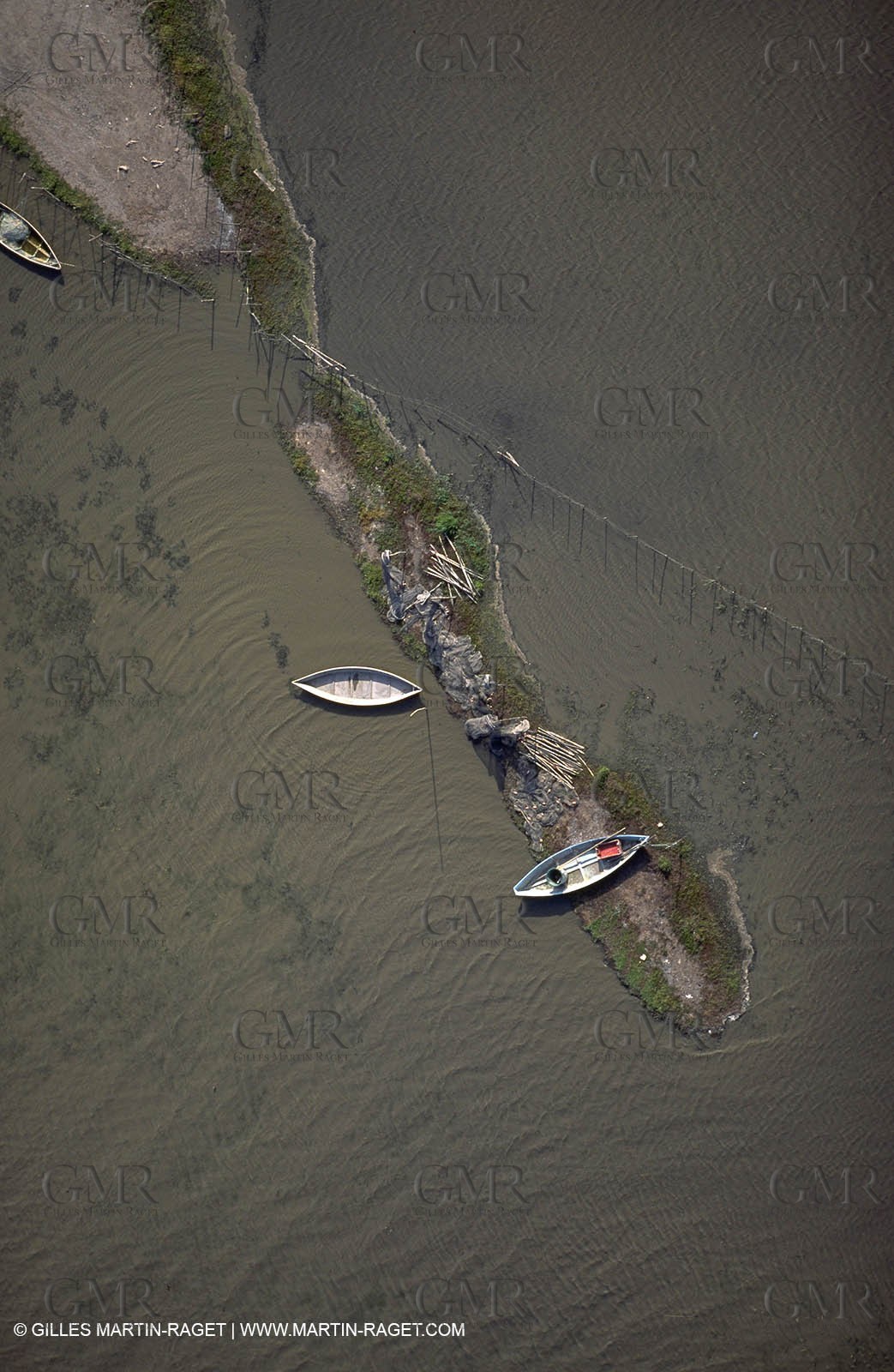 Fishmen boats in a pond