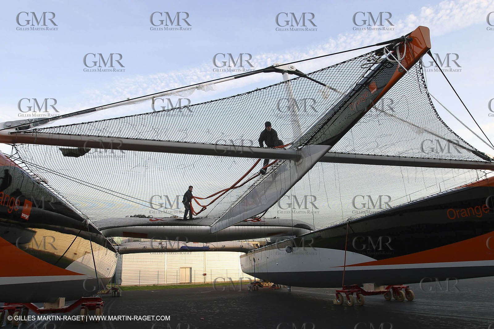Vannes - Multiplast Boatyard - Orange II going out of the shed