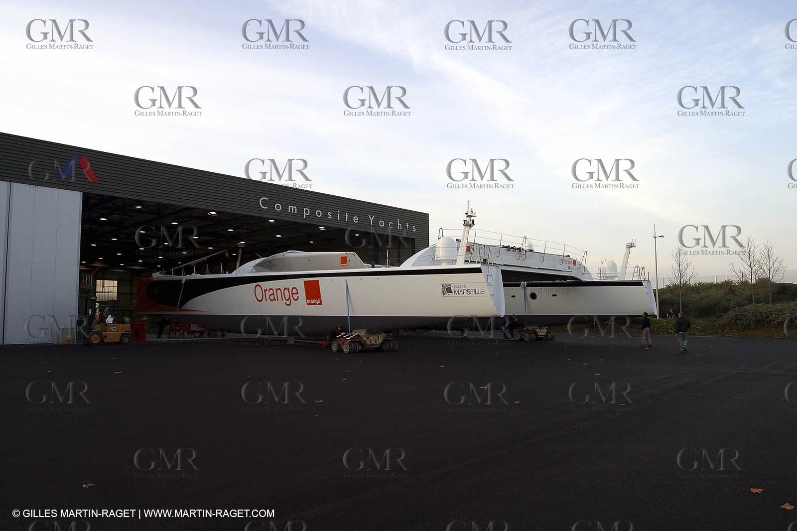 Vannes - Multiplast Boatyard - Orange II going out of the shed